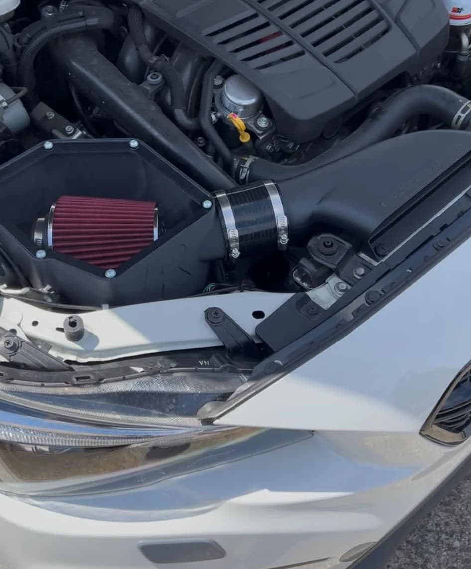 The VA WRX intake system fitted in the engine bay, cover off, showing the K&N filter