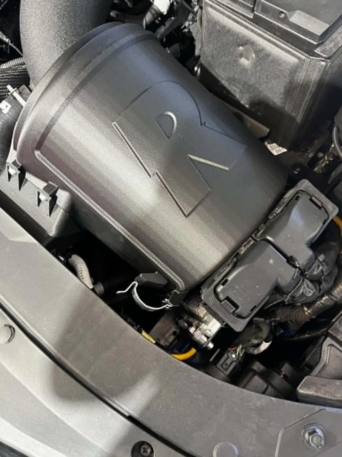 Roccomotive airbox enclosure with the R moulded into it, fitted around the Forge intake in a Hyundai i30 N Sedan