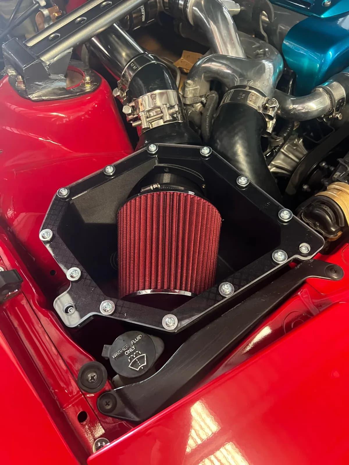 Roccomotive A70 Supra airbox with K&N filter fitted in a red Supra engine bay